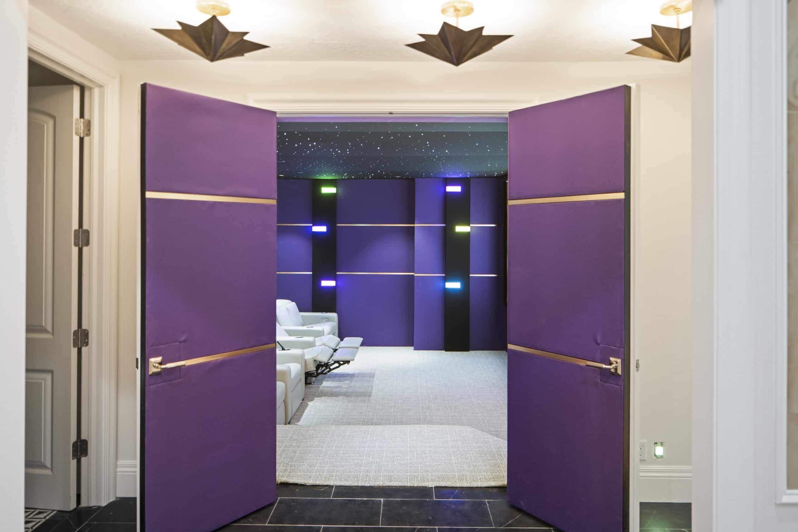 Colorful LED-lit sensory space at Nerve Inc featuring purple walls and comfortable seating for therapy.