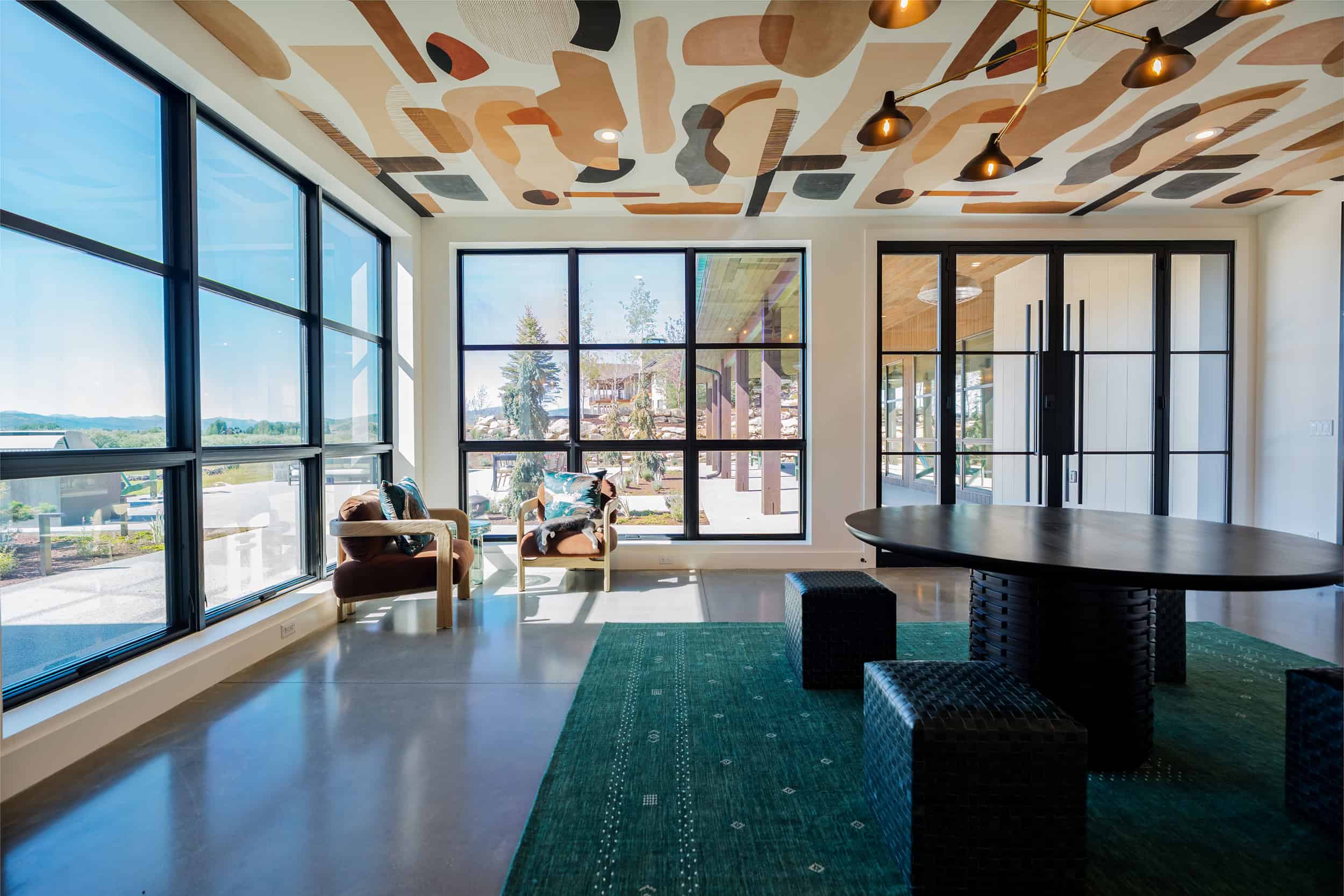 Bright sitting area featuring expansive windows and contemporary decor in Park City.